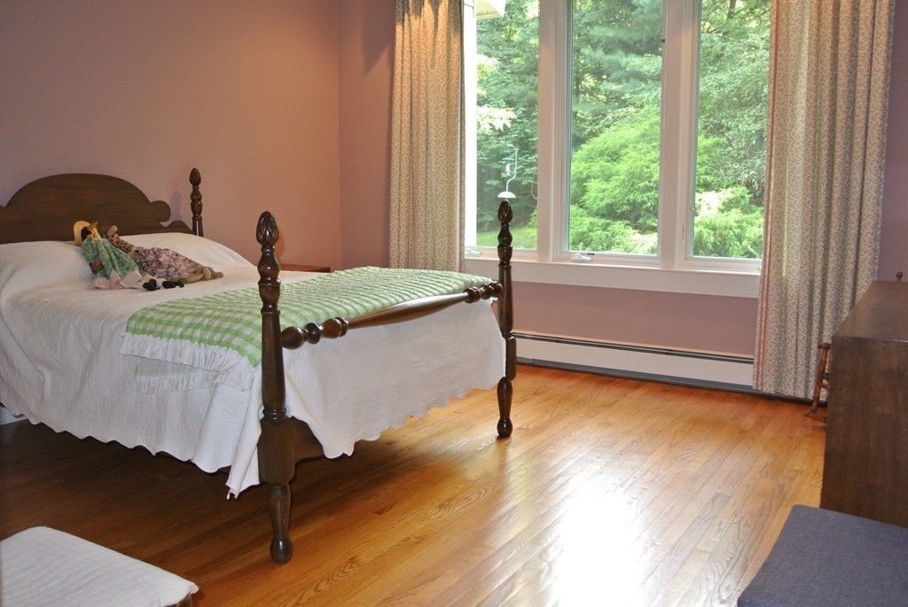 423 Concord Road Weston, MA 02493 - Photo 26 of 30 a bedroom with a bed and window