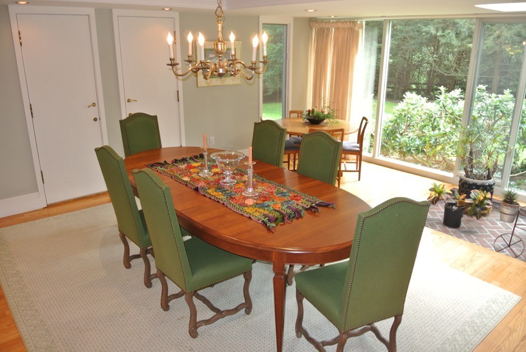 423 Concord Road Weston, MA 02493 - Photo 7 of 30 a view of a dining room with furniture a chandelier and wooden floor