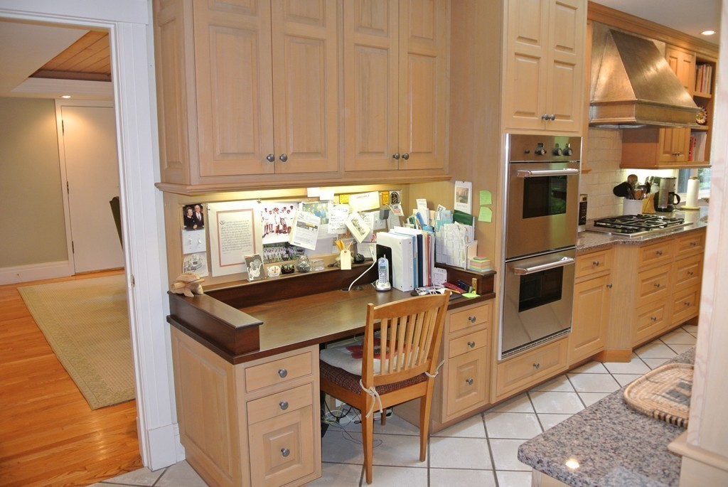 423 Concord Road Weston, MA 02493 - Photo 8 of 30 a kitchen with stainless steel appliances granite countertop a stove top oven a sink and dishwasher