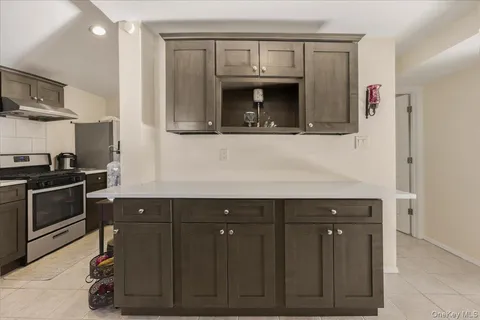 a kitchen with a sink and a microwave