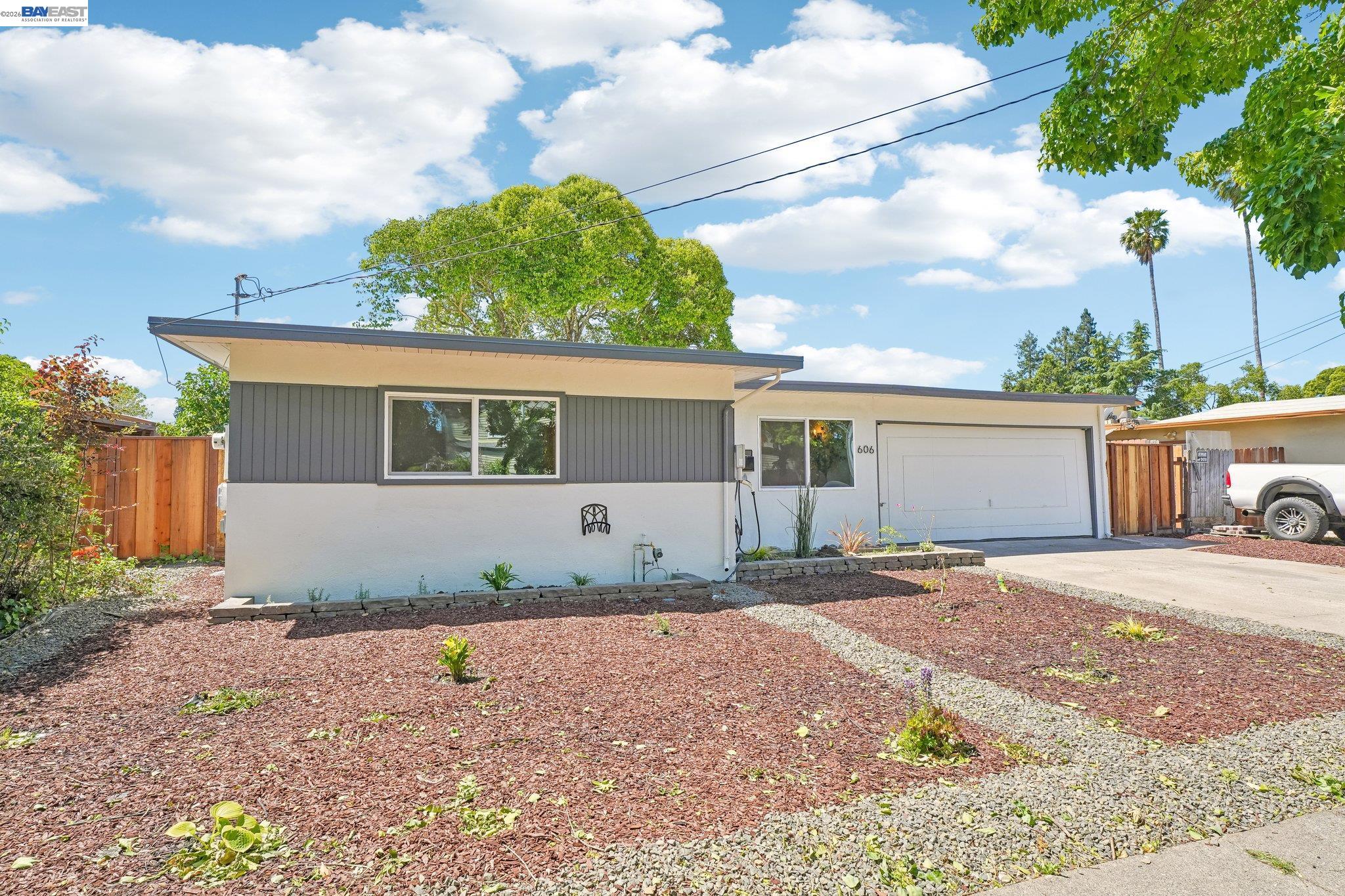 606 West 9th Street Santa Rosa, CA 95401 - Photo 6 of 52 a front view of a house with a yard and a garage