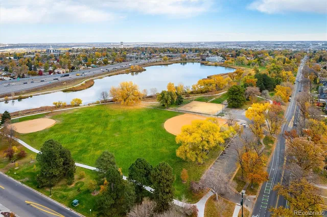 an aerial view of residential houses with outdoor space and river