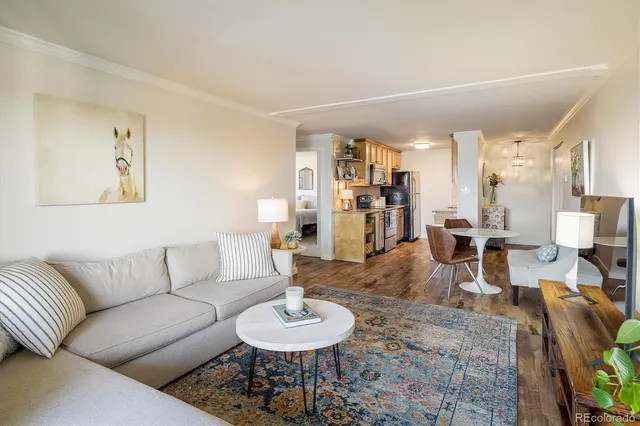 a living room with furniture and a table
