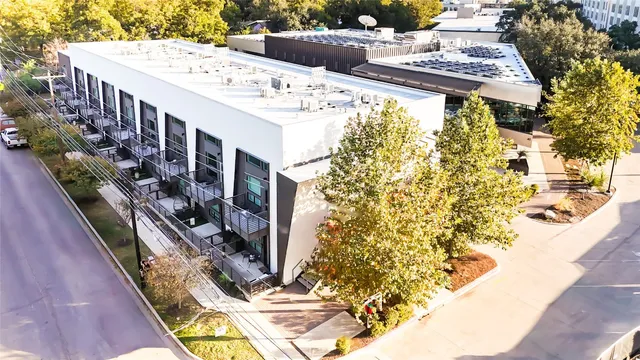 a view of a swimming pool with outdoor seating