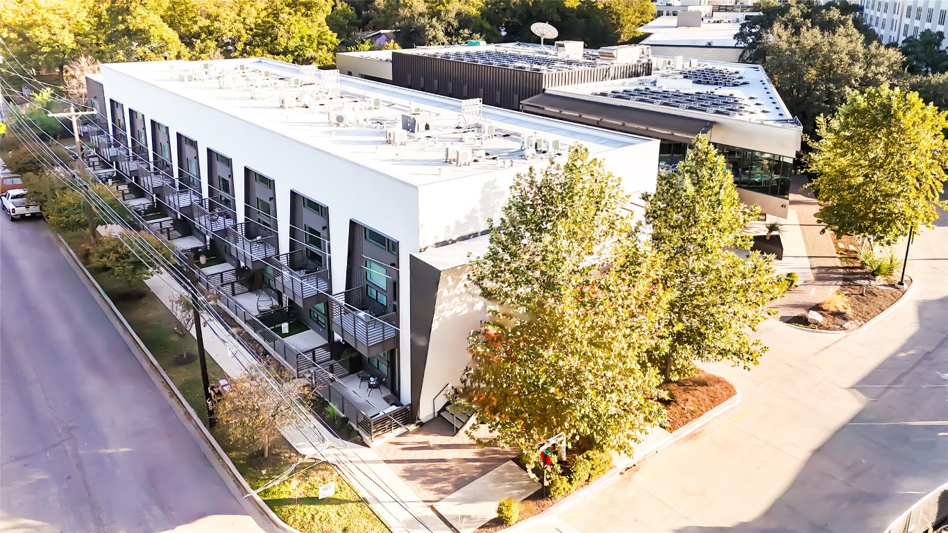 49 Navasota Street, Unit 209 Austin, TX 78702 - Photo 1 of 32 a view of a swimming pool with outdoor seating