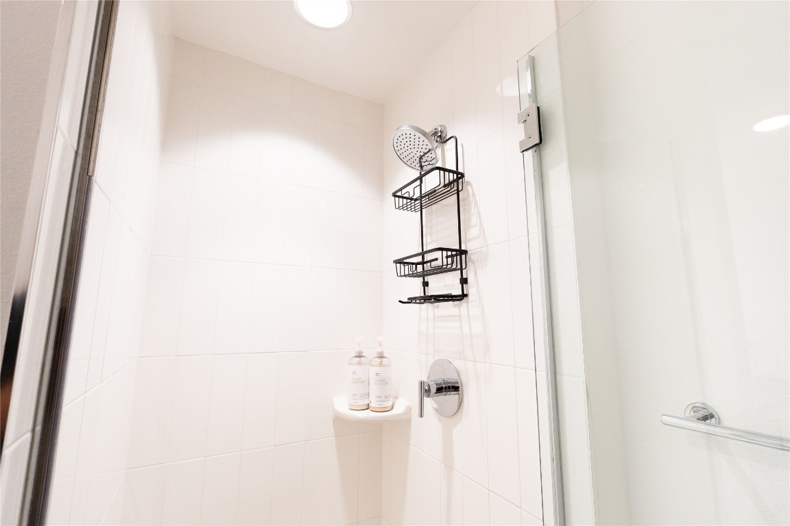 49 Navasota Street, Unit 209 Austin, TX 78702 - Photo 12 of 32 a bathroom with a shower