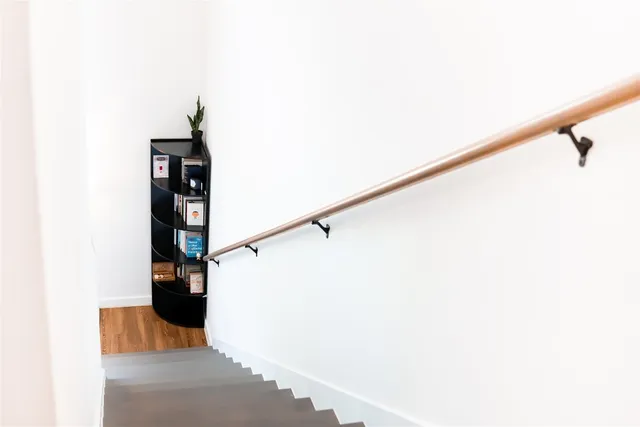 a room with a bed and a night stand