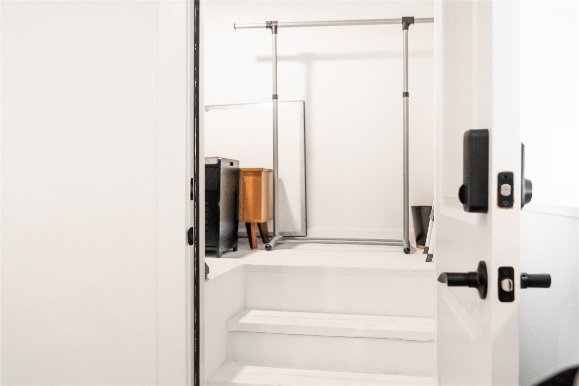 49 Navasota Street, Unit 209 Austin, TX 78702 - Photo 22 of 32 a bathroom with a shower and a mirror