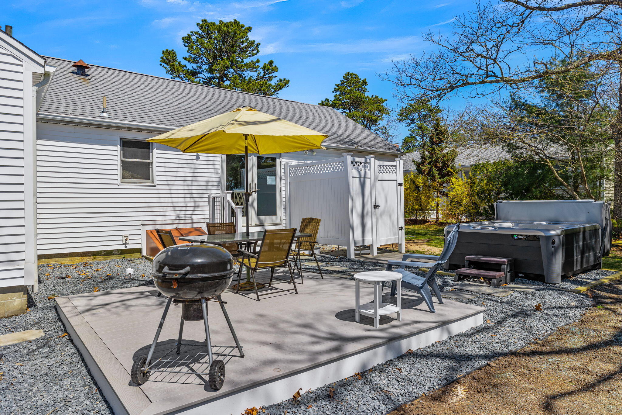 121 Lower County Road Dennis Port, MA 02639 - Photo 33 of 37 a view of house with backyard and outdoor seating