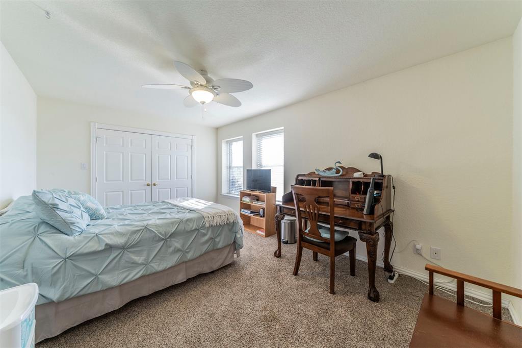 20175 Willow Glade Circle Pilot Point, TX 76258 - Photo 18 of 32 Carpeted bedroom featuring ceiling fan and a closet