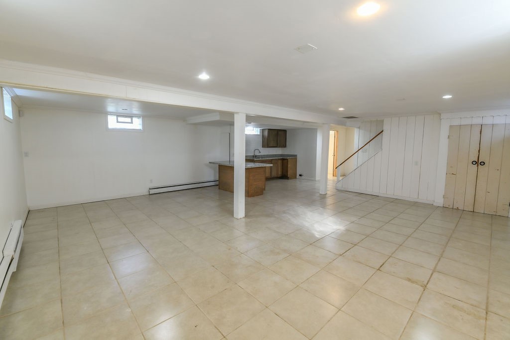 281 Ellison Street Rochester, NY 14609 - Photo 19 of 26 A large basement finished area, has glass block wi