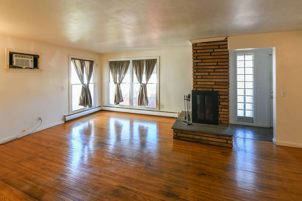 281 Ellison Street Rochester, NY 14609 - Photo 4 of 26 Main entrance opens to living room and dining spac