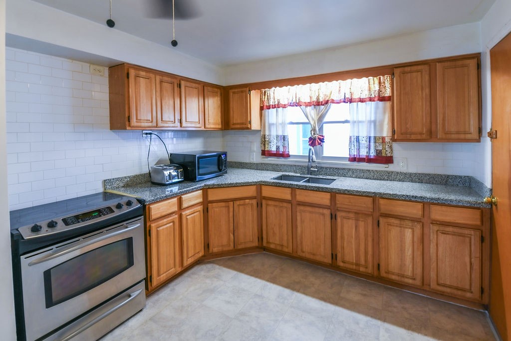 281 Ellison Street Rochester, NY 14609 - Photo 6 of 26 Kitchen with stainless steel oven/electric cooktop