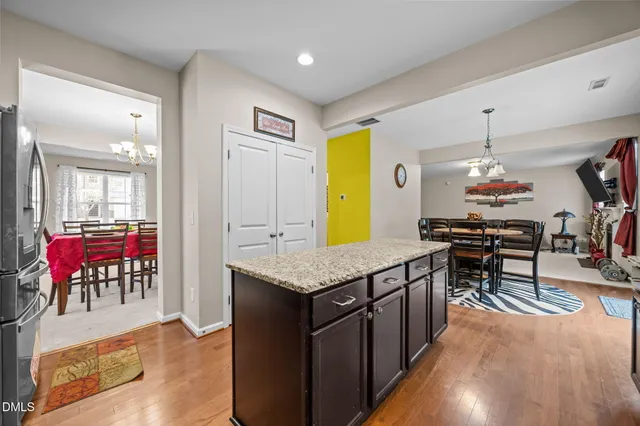 a kitchen with granite countertop stainless steel appliances and wooden cabinets