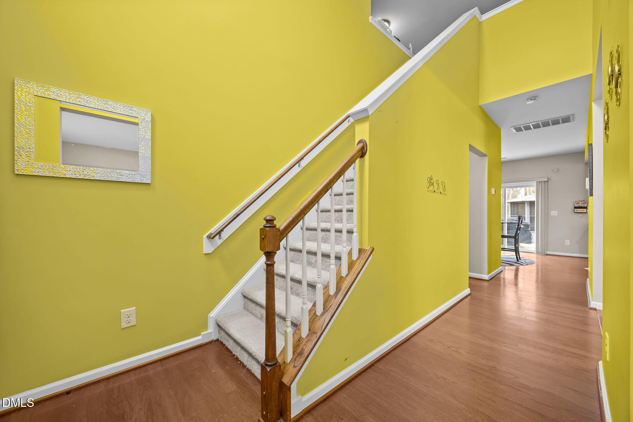 2021 Muddy Creek Court Raleigh, NC 27610 - Photo 21 of 47 a view of a hallway with wooden floor and stairs