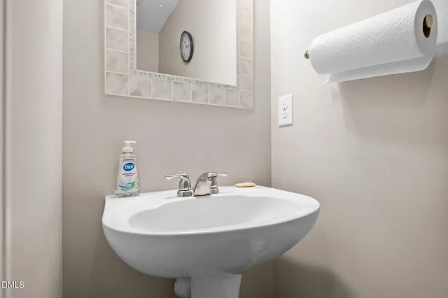 a view of a hallway with wooden floor and stairs