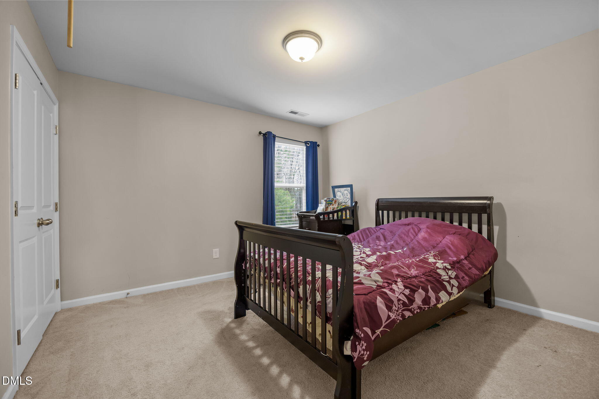 2021 Muddy Creek Court Raleigh, NC 27610 - Photo 26 of 47 a bedroom with a bed and window