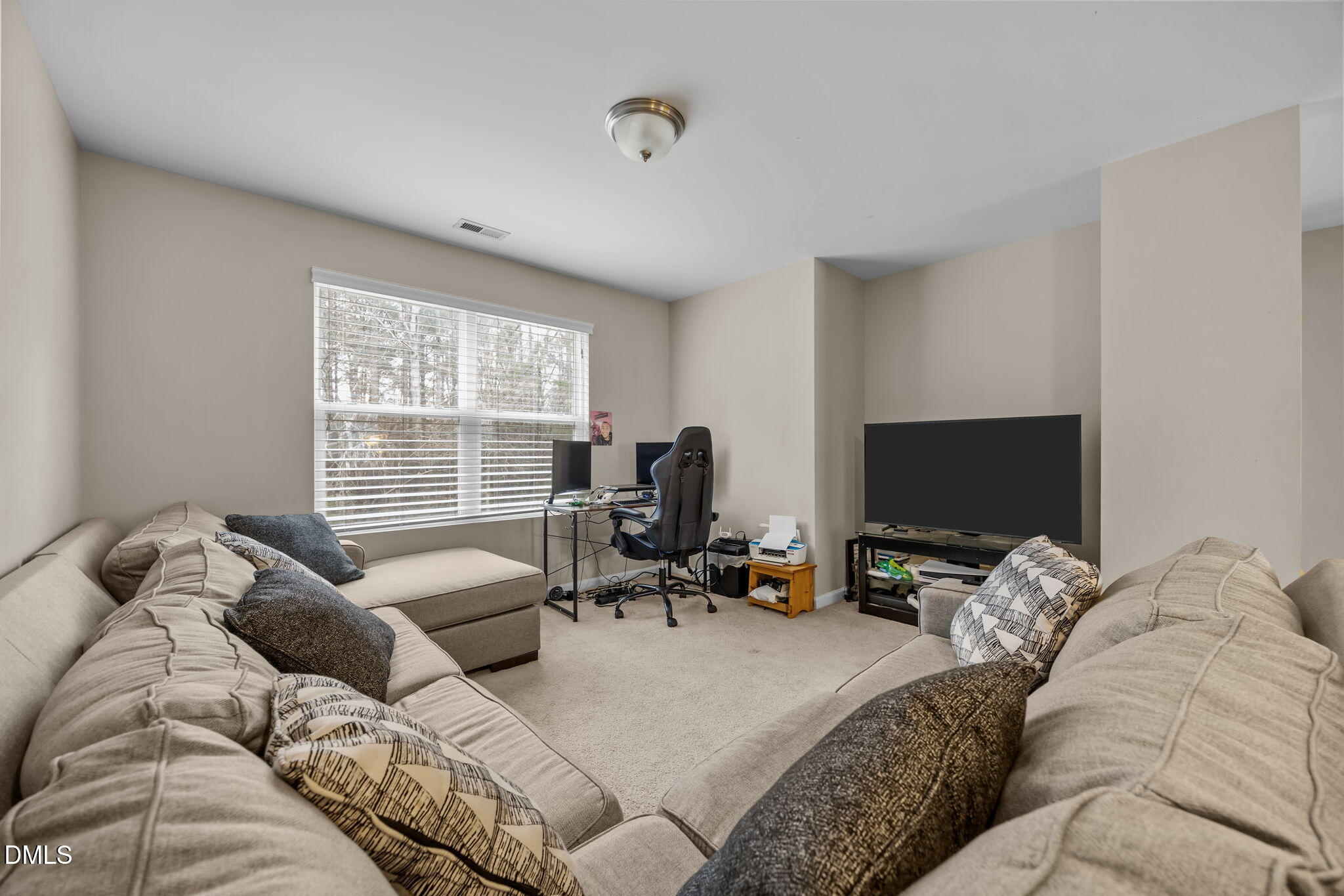 2021 Muddy Creek Court Raleigh, NC 27610 - Photo 27 of 47 a bedroom with a bed and flat screen tv