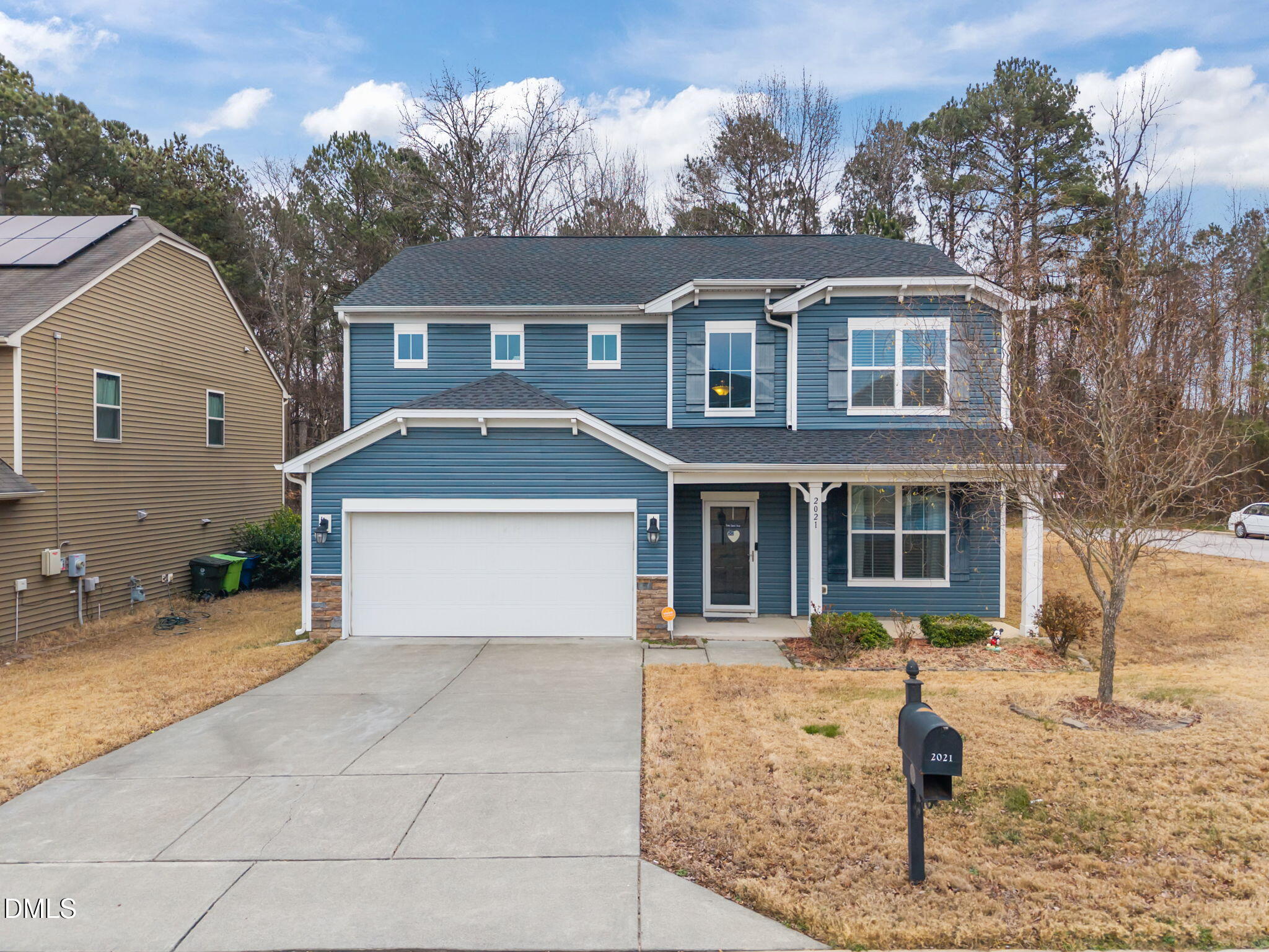 2021 Muddy Creek Court Raleigh, NC 27610 - Photo 2 of 47 a front view of a house with yard