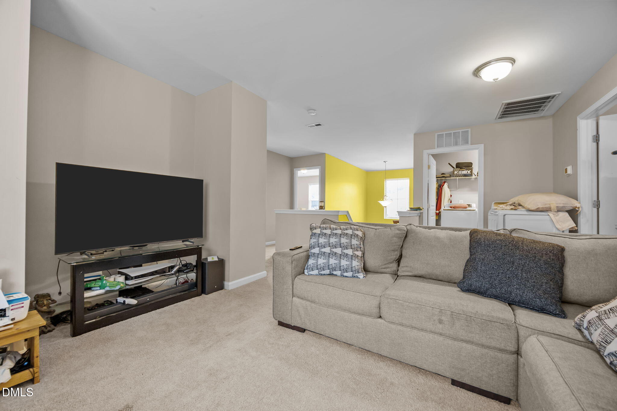 2021 Muddy Creek Court Raleigh, NC 27610 - Photo 28 of 47 a living room with furniture and a flat screen tv