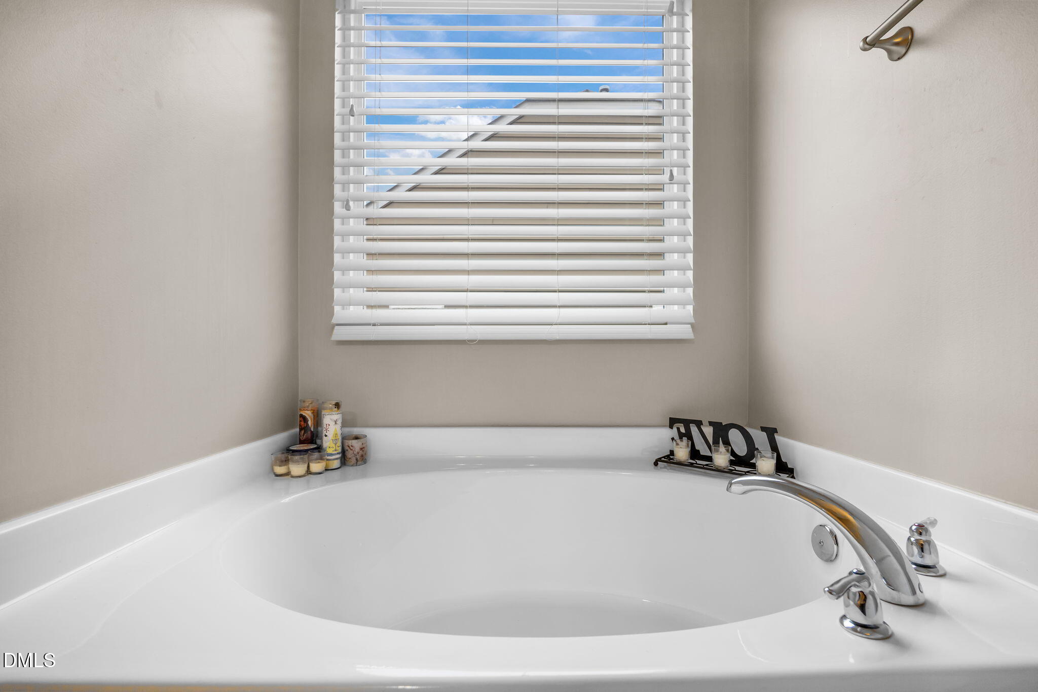 2021 Muddy Creek Court Raleigh, NC 27610 - Photo 32 of 47 a white bath tub sitting in a bathroom