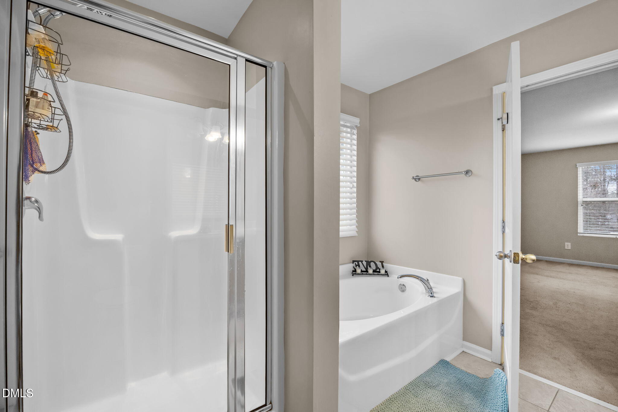 2021 Muddy Creek Court Raleigh, NC 27610 - Photo 33 of 47 a bathroom with a bathtub and a shower