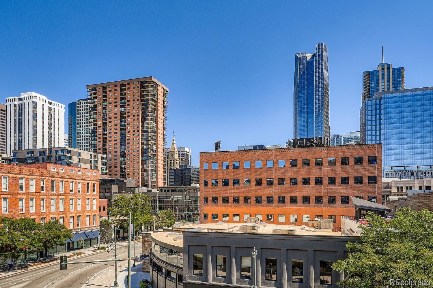 1499 Blake Street, Unit 4G Denver, CO 80202 - Photo 16 of 33 a large building with a clock on the wall