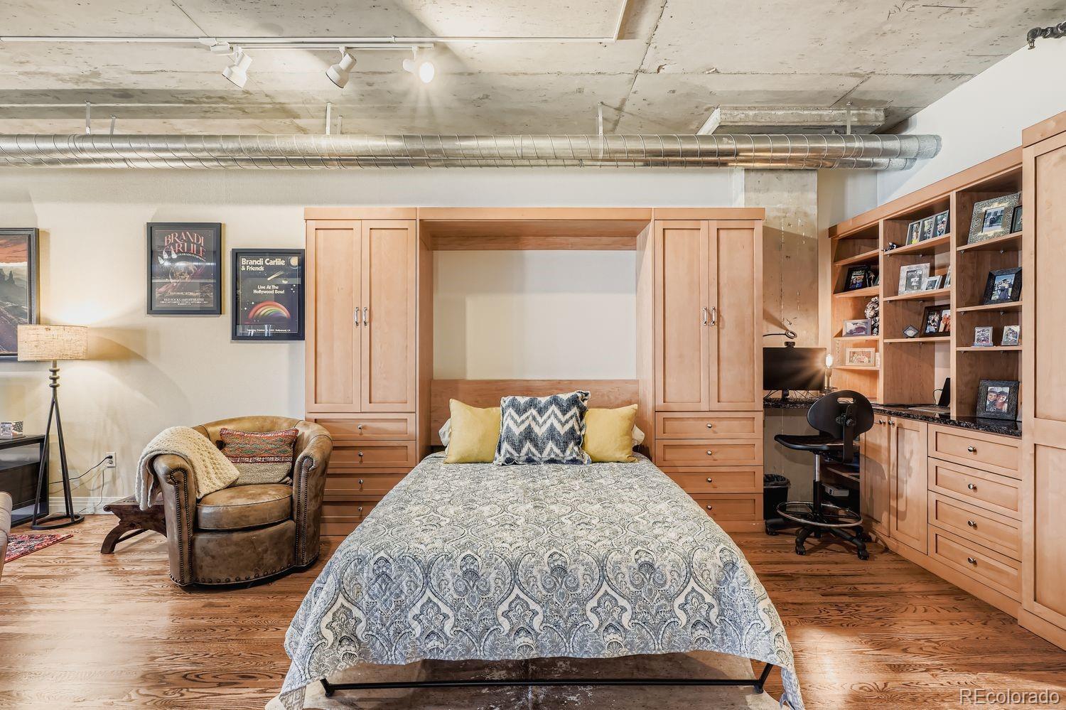 1499 Blake Street, Unit 4G Denver, CO 80202 - Photo 18 of 33 a bedroom with a bed and furniture