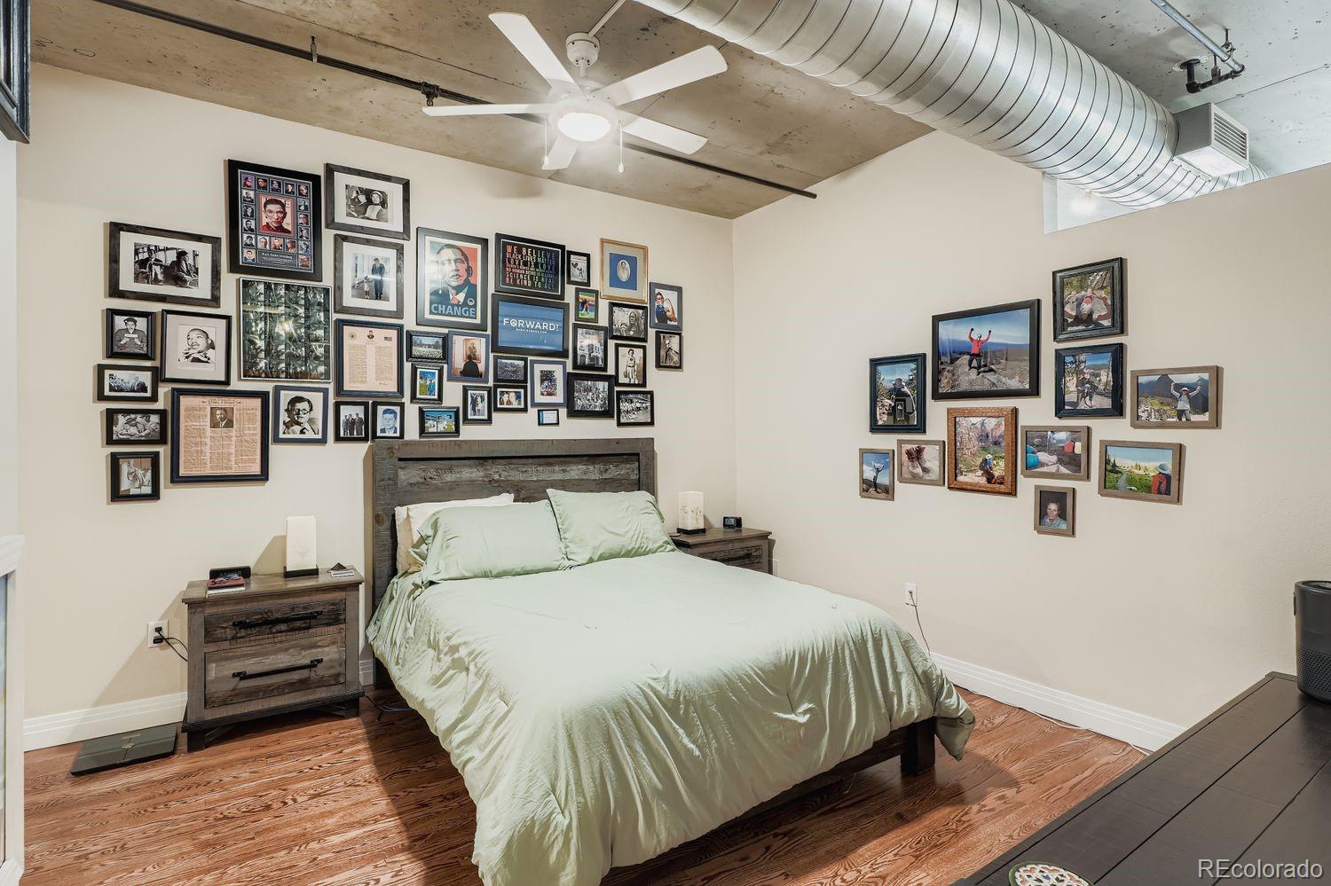 1499 Blake Street, Unit 4G Denver, CO 80202 - Photo 19 of 33 a bedroom with a bed and a book shelf