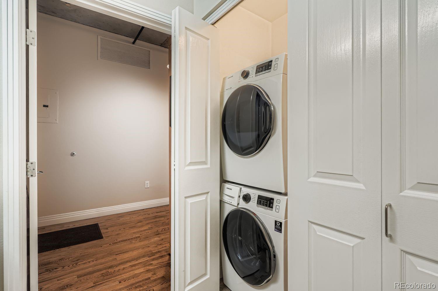 1499 Blake Street, Unit 4G Denver, CO 80202 - Photo 24 of 33 a view of a hallway with washer and dryer