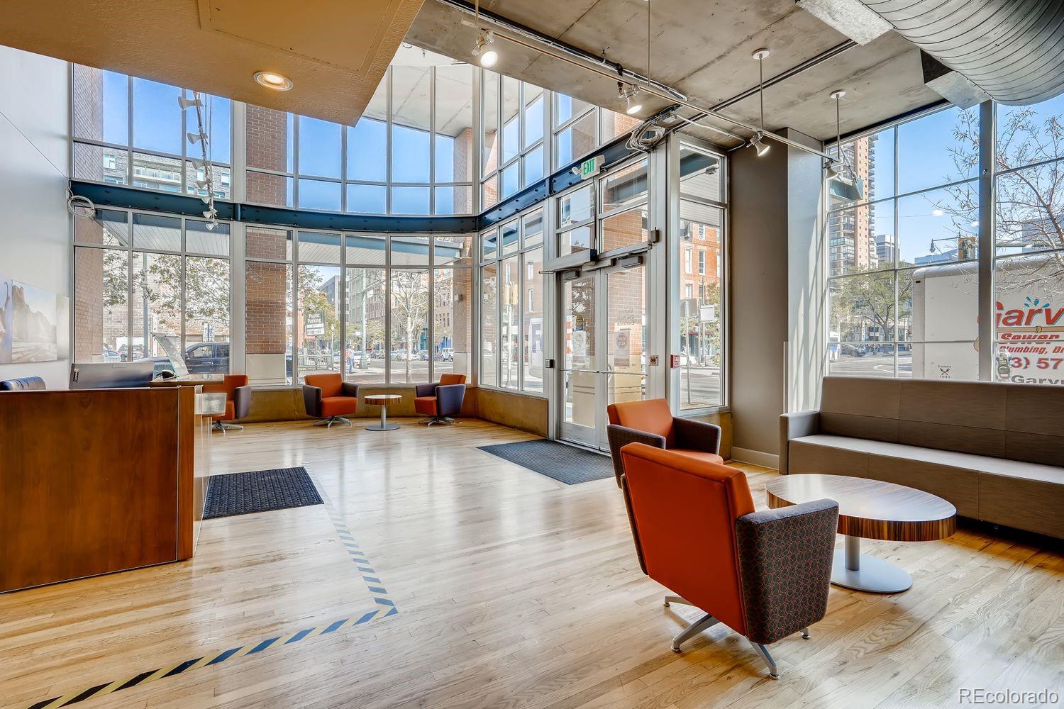 1499 Blake Street, Unit 4G Denver, CO 80202 - Photo 26 of 33 a living room with furniture a large window