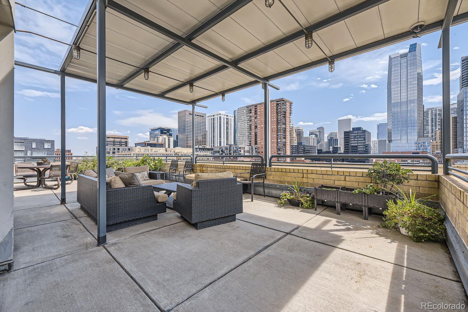 1499 Blake Street, Unit 4G Denver, CO 80202 - Photo 28 of 33 a view of a terrace with a flat screen tv