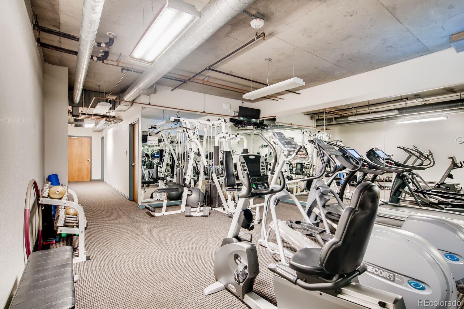1499 Blake Street, Unit 4G Denver, CO 80202 - Photo 30 of 33 a view of a room with gym equipment