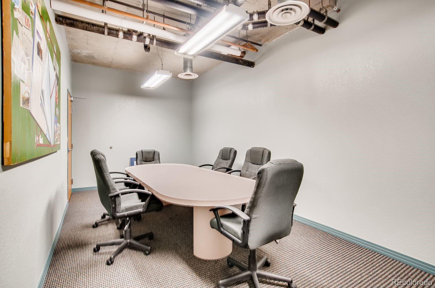 1499 Blake Street, Unit 4G Denver, CO 80202 - Photo 32 of 33 a view of a workspace with furniture and a chair