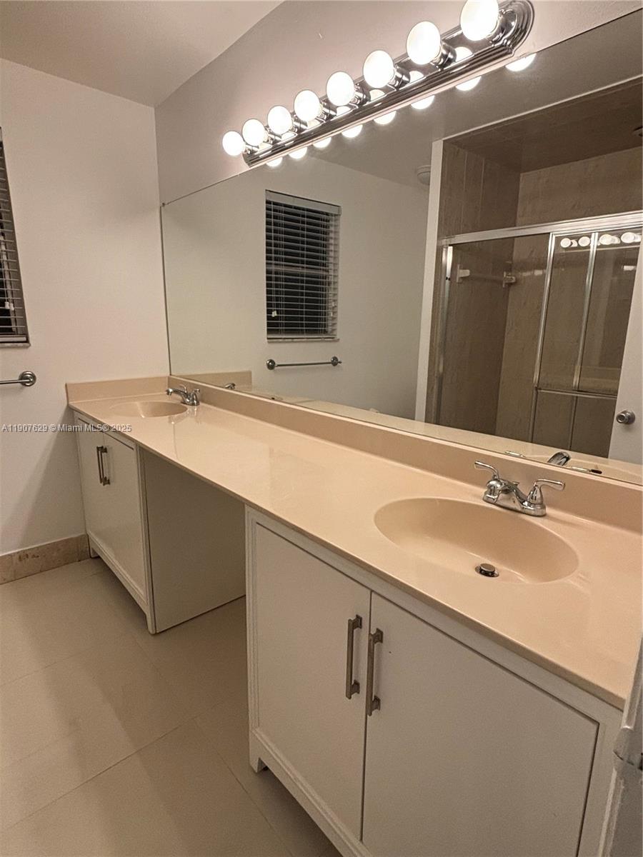 River Run Miramar, FL 33025 - Photo 12 of 29 a bathroom with a sink and a mirror