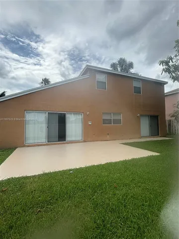 a view of backyard with green space