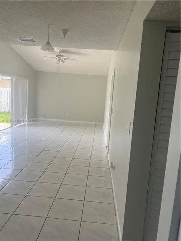 a kitchen with a stove a sink and a refrigerator