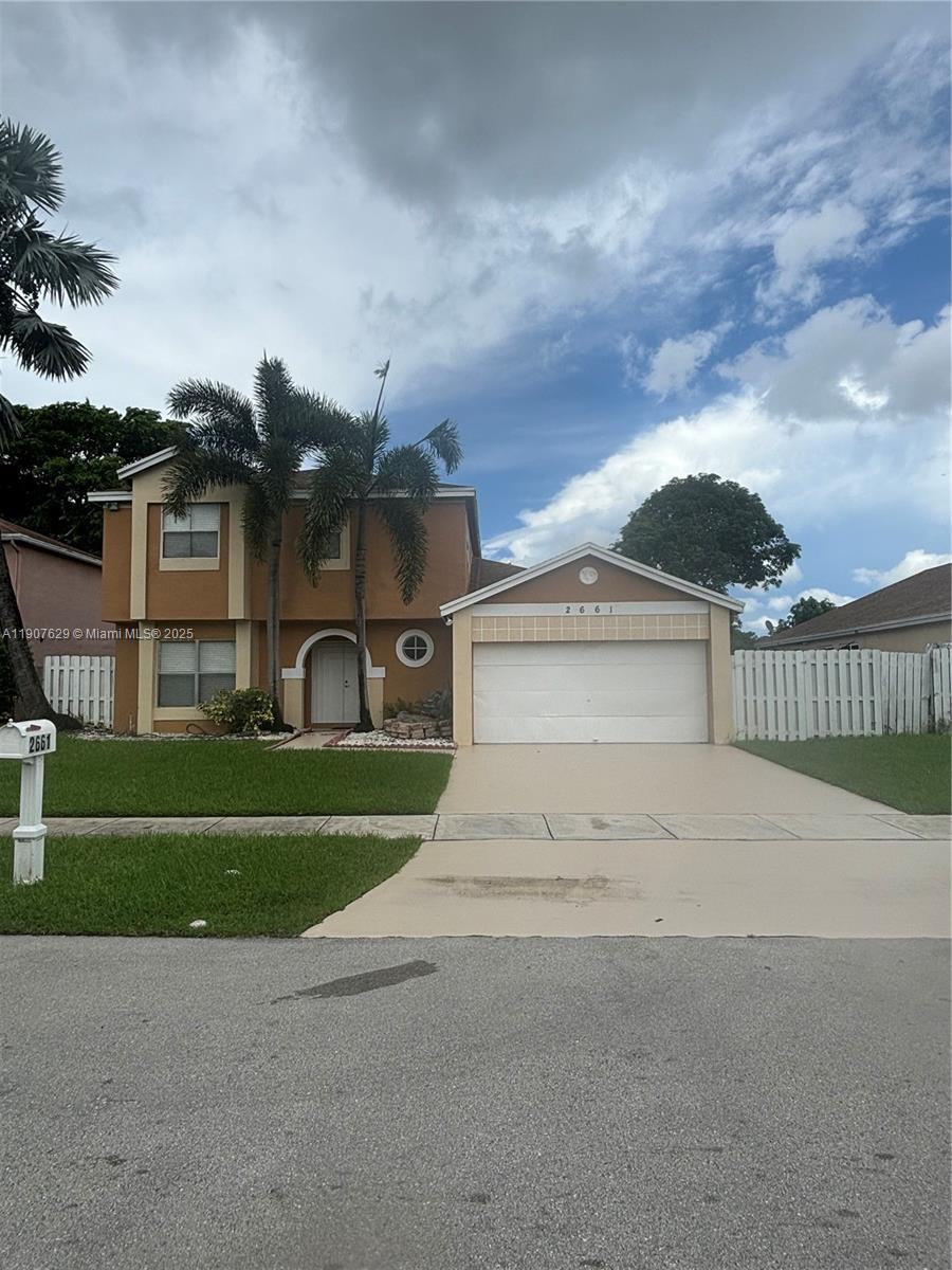River Run Miramar, FL 33025 - Photo 4 of 29 a view of a house with a yard and a street