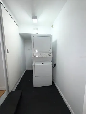 a view of a yard with large trees