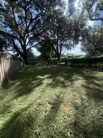 a front view of a house with a yard table and chairs