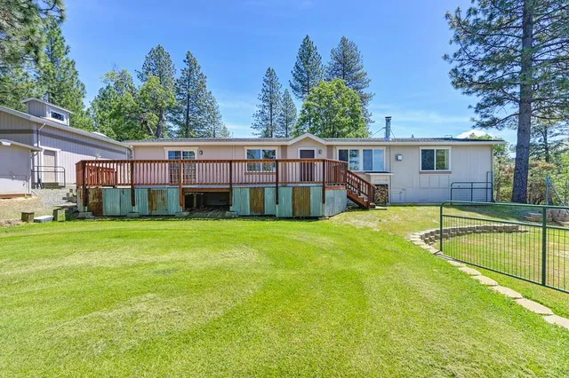 a kitchen with stainless steel appliances granite countertop a stove a sink dishwasher and a refrigerator