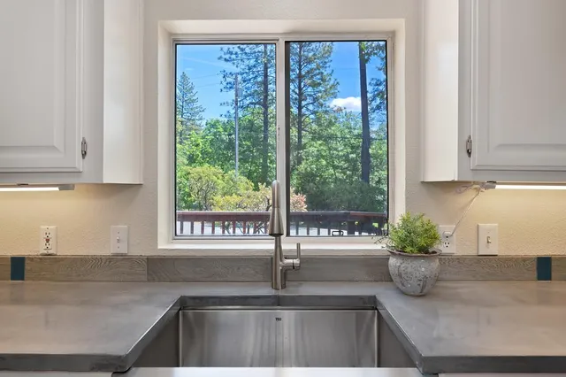 a view of a livingroom with furniture and a window