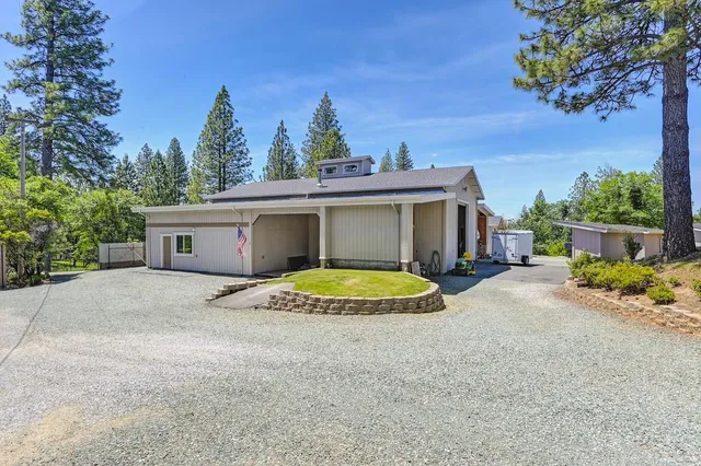 a view of a house with a snow and yard