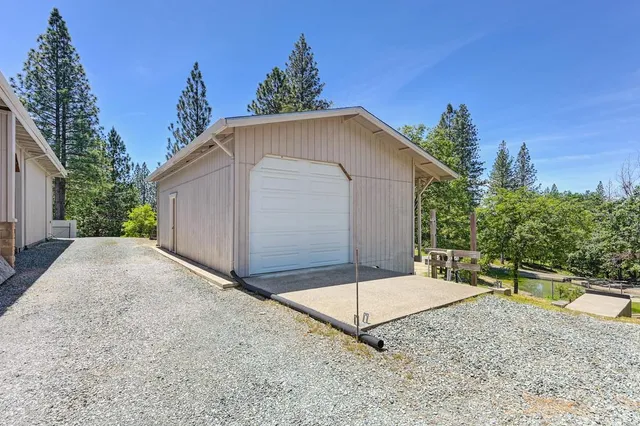 a view of a swimming pool with a yard