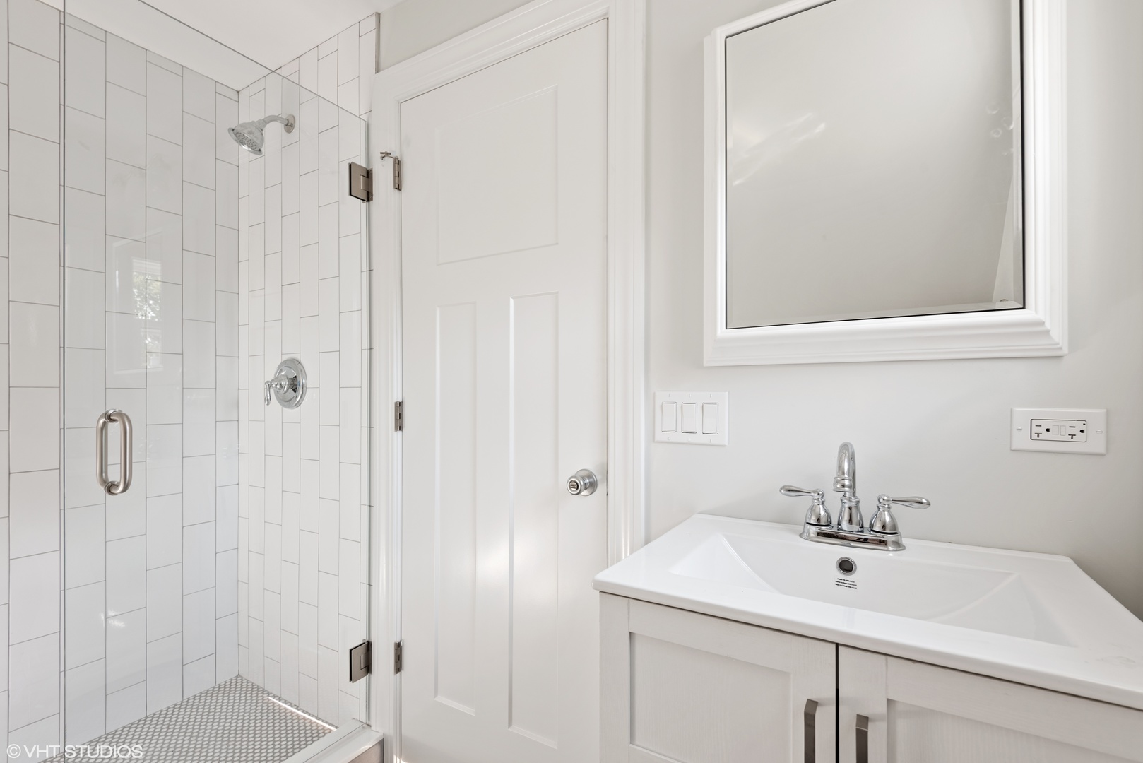 1131 Ridge Road, Unit 2 Wilmette, IL 60091 - Photo 12 of 12 a bathroom with a sink a vanity and shower