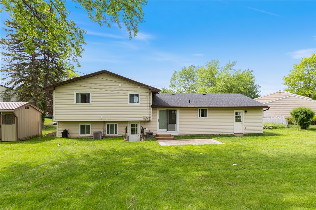 218 Kusak Road Henrietta, NY 14467 - Photo 6 of 33 Backyard showing walkout from lower level.