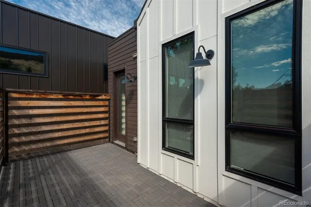 a living room with furniture and a painting