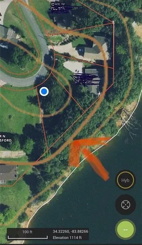 an aerial view of a residential houses with outdoor space and street view