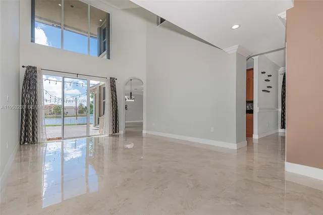 a view of empty room with floor to ceiling window