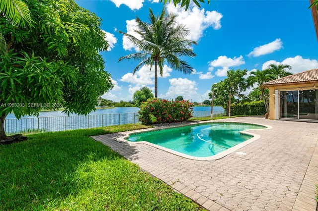 a view of a lake with houses in the back